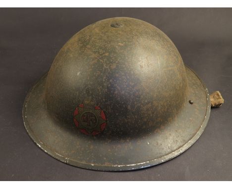 A WWII Norfolk Fire Service helmet dated 1939, with chin strap 