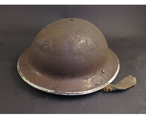 A WWII British Infantry helmet, Fisher and Ludlow Ltd (1939-42), dated 1939 a/f