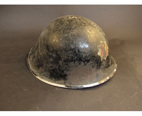 A WWII British Type III helmet used as a fireman's helmet