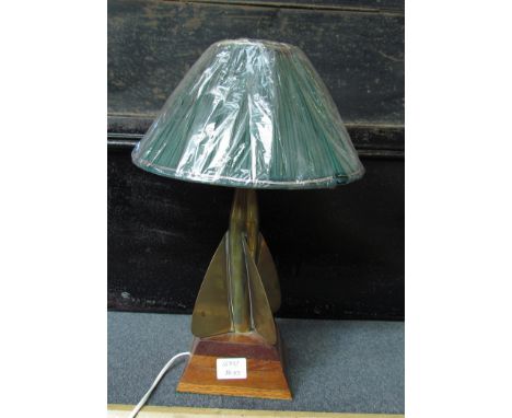 A nautical table lamp base crafted from teak and a brass ship's log 