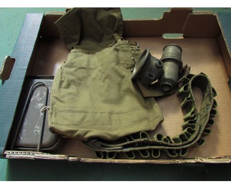 A box containing mixed militaria including cases, a post war bandolier, a mess tin and carbide lamp 