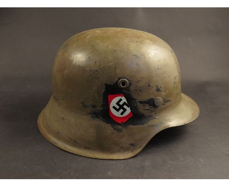 A German pattern M42 helmet, maker Vereinigte Deutsche Nickelwerke Schwerte, liner 1939 dated, later decals