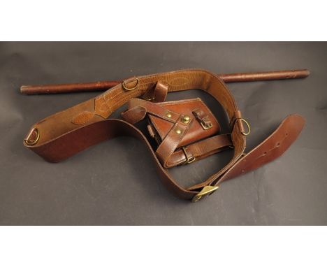 A Sam Browne leather belt and sword frog together with officer's swagger stick