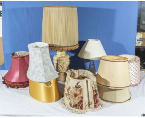A  collection of lamp shades and lamps