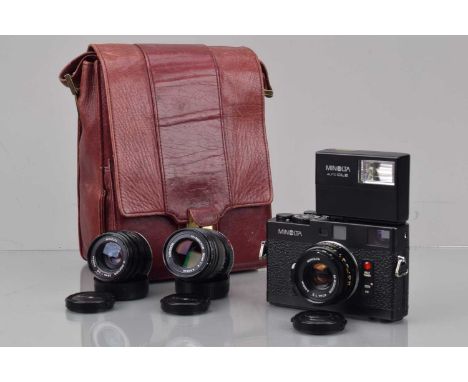 A Minolta CLE Rangefinder Camera Outfit, serial no 1015338, shutter working, meter responsive, responsive in auto, self timer