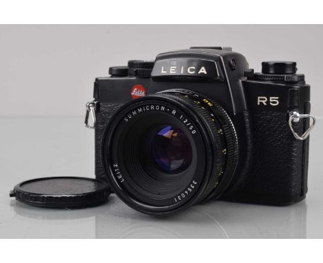 A Leitz Leica R5 SLR Camera,  black, serial no 1699056, 1986, shutter working, meter responsive, responsive in settings, self