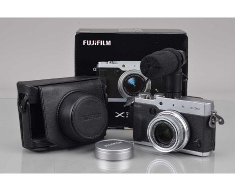 A Fujifilm X30 Digital Camera, silver/black, shutter working, flash working, display working, self timer working, appears to 