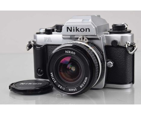 A Nikon FA SLR Camera, chrome, shutter working, meter responsive, responsive in settings, self timer working, body G-VG, some