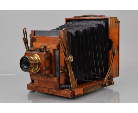 A Sanderson Half Plate Mahogany & Brass Camera, double extension, brass bound on corners, body G, brass G, clip missing to lo