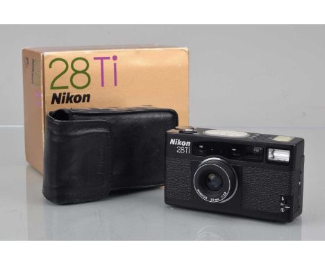 A Nikon 28 Ti Camera, serail no 5011339, shutter working, dials working, flash working, self timer working, appears to functi
