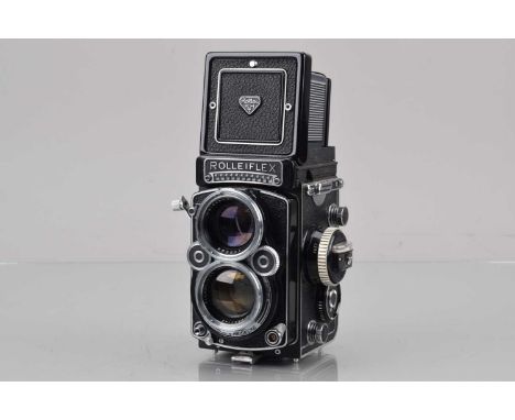 A Rolleiflex 2.8F TLR Camera, serail no 2401554, shutter working, light cell responsive, self timer working, body G-VG, with 