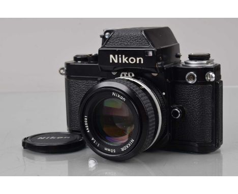 A Nikon F2 Photomic SLR Camera, black, serial no 7477382, shutter working, meter responsive, self timer working, body G, slig