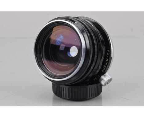 A Nippon Kogaku PC-Nikkor 35mm f/3.5 Lens, serial no 103611, shift moves freely, barrel G, some light paint wear, elements VG