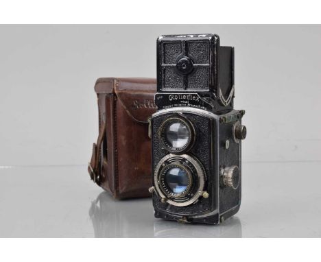A Rolleiflex 4 x 4 Original (Baby) TLR Camera, shutter working, body F, paint wear, brassing, damage to corner of name plate,
