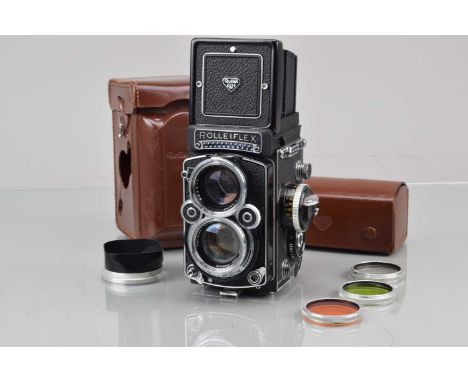 A Rolleiflex 2.8F TLR Camera, serail no 2450564, shutter working, light cell responsive, self timer working, body G-VG, with 