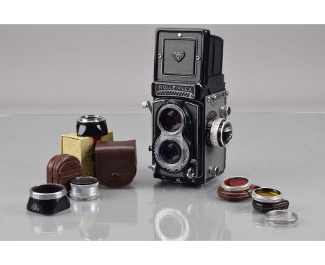 A Rolleiflex T TLR Camera, grey, type 2, serial no T 2128697, shutter working, light cell responsive, self timer working, bod