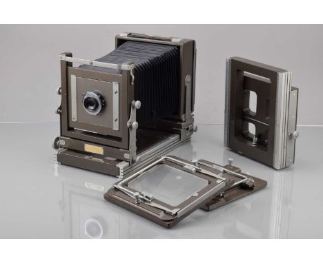 A Model 2 Kodak Specialist Camera, serial no 1615, body G, light wear, bellows G, all moves freely, with Kodak Ektar 203mm f/