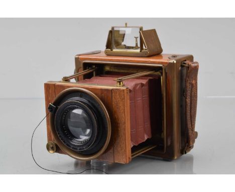 An Ernemann Klapp Tropen Tropical Folding Strut Camera,  serial no 1193824,  shutter not cocking, body G, light marks, some t