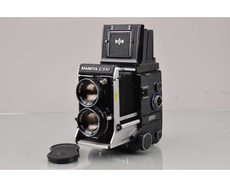 A Mamiya C330 Professional F TLR Camera, serial no D 141281, body G-VG, some light paint scratches bottom front, bellows G-VG