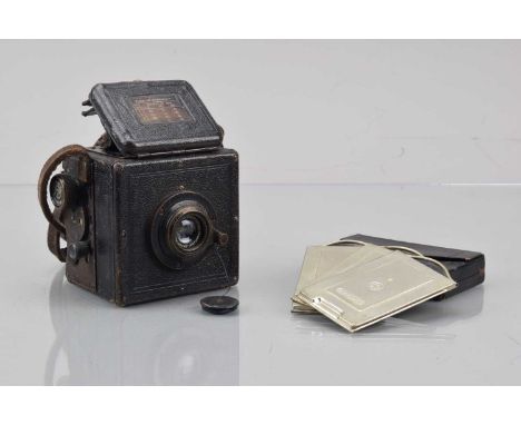 An Ernemann Ermanox 4 X 5.5 Reflex Camera, shutter AF, no curtain, body F, brassing and wear, with Ernemann 7.5cm f/4.5 Earno