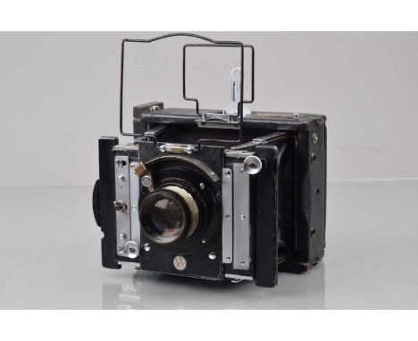 A Van Neck 9x12cm Press Camera, shutter not working, shutter curtain deteriorated, body G, bellows F-G, with Ross Xpress 6in 