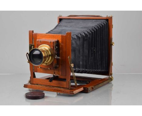 A Mahogany & Brass Whole Plate Camera, double extension, body & brass G-VG, bellows G, with ratcheted rise & fall lens board,