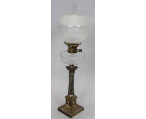 A 19thC silver plated Corinthian column oil lamp, with a cut glass reservoir, acid etched shade and chimney, the base 55cm hi