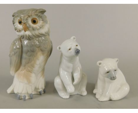 Three Spanish porcelain figures, two Lladro polar bears and a Nao owl. (3)