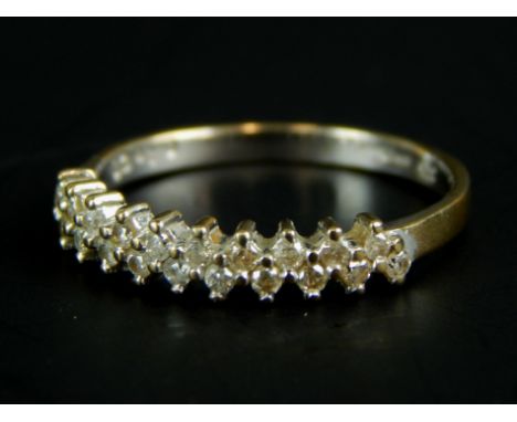 A 9ct white gold dress ring, set with white stones, 1.3g all in. 