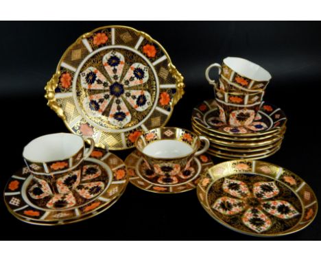 A quantity of Royal Crown Derby bone china cups and saucers, to include a cake plate, two matched side plates, a set of four 