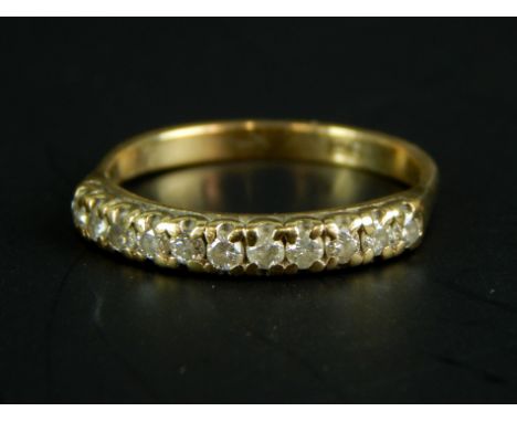 A 9ct gold dress ring, set with nine white stones, 1.6g all in. 