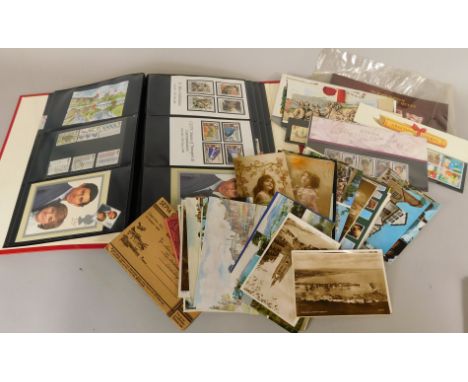 A quantity of early 20thC postcards, first day covers, etc.