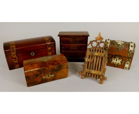 A group of treen, including a walnut money box, a domed brass and ivory mounted walnut trinket box, a miniature chest of draw
