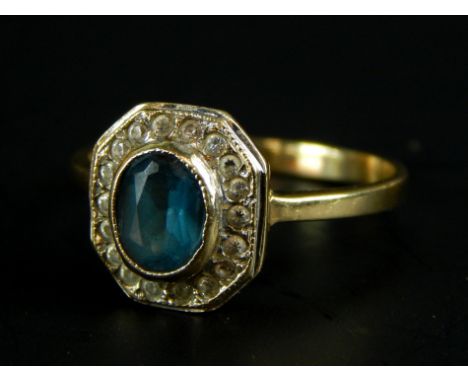 A 9ct gold dress ring, set with central blue stone, surrounded by marquise stones, 2.3g all in. 