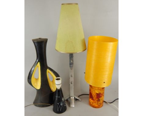 A collection of 1960-70's table lamps, to include an aluminium lamp, 'Light', a stylised amber example, etc. 