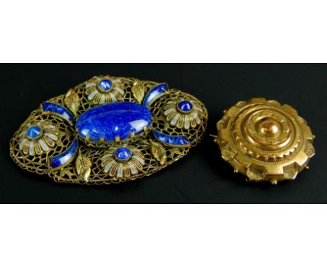 Two brooches, to include a filigree, enamel and lapis design brooch, gold plated, and another. 