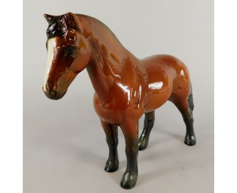 A Goebel ceramic model of a brown horse, printed mark to underside and indistinct number.