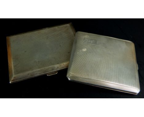 Two Art Deco style engine turned silver cigarette cases, one engraved Phyl, Birmingham 1940, and another similar, 6½oz overal