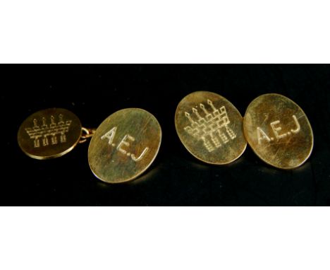 A pair of 9ct gold cufflinks, with arrow design, and initials A.E.J, 8.9g, boxed.  