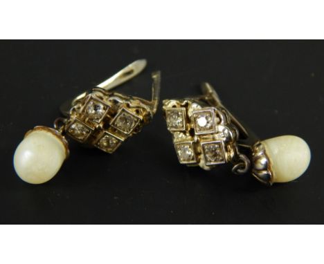 A pair of silver drop earrings, with freshwater pearl drop, with four pave set white stones, 5.6g all in. 