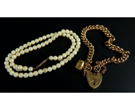 A 9ct gold charm bracelet, 21.5g all in, and a pearl necklace with 9ct gold clasp, (2). 
