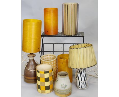 A collection of retro items, to include various shades, two lamp bases, and a magazine rack.