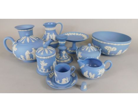 A collection of Wedgwood pale blue Jasperware, items to include a teapot and cover, two handled sugar bowl, candlestick, jug,