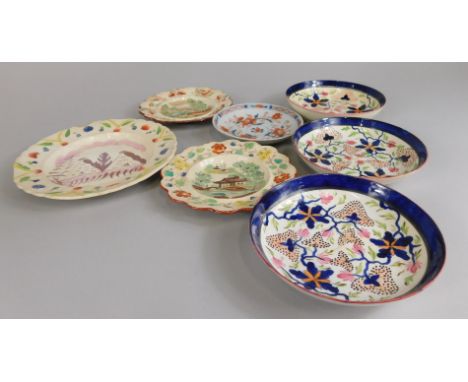 A collection of ceramics, to include children's plates, two saucers, decorated with flowers in blue and pink, and a copper lu