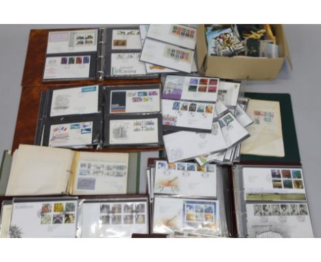 A large quantity of first day covers, loose postcards etc.