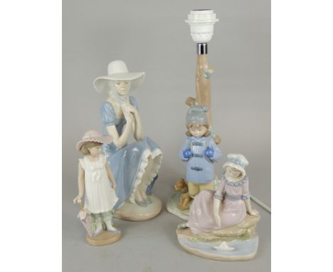 Four items of Lladro porcelain, to include a large figure of a girl wearing a bonnet, a table lamp modelled in the form of a 