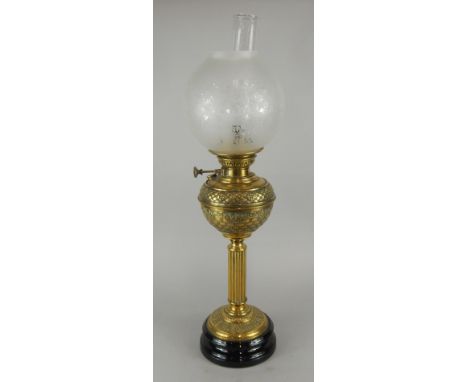 A Victorian brass column oil lamp, with etched type shade on ceramic base, 72cm high.