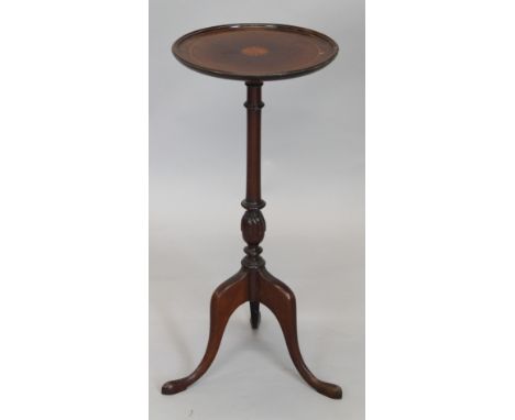 An early 20thC mahogany occasional table, the circular dish top, with a central marquetry fan, on turned column and tripod ba