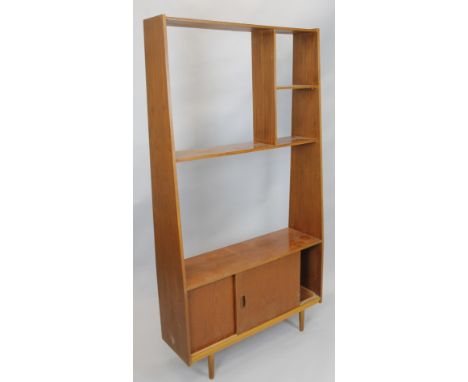 A 1970-80's teak display shelf, in G-Plan style with arrangement of shelves and sliding doors, 191cm wide.