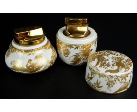 Two items of Royal Crown Derby pottery in the Gold Aves style, to include a lighter and another lidded lighter, 8 and 9cm hig